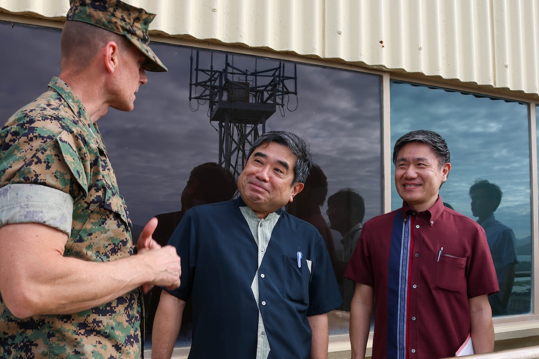 U.S. Marine Corps Col. Jeremy Beaven, left, commanding officer, Marine Corps Base Hawaii, gives a tour of the installation to Takekuni Ikeda, center, vice governor, Okinawa Prefectural  Government, on Kansas Tower at MCBH, Jan. 31, 2024. The visit highlighted the friendship between Okinawa and Hawaii as well as the shared challenges faced by both locales. (U.S. Marine Corps photo by Lance Cpl. Marcos AlbertoRocha)