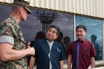 U.S. Marine Corps Col. Jeremy Beaven, left, commanding officer, Marine Corps Base Hawaii, gives a tour of the installation to Takekuni Ikeda, center, vice governor, Okinawa Prefectural  Government, on Kansas Tower at MCBH, Jan. 31, 2024. The visit highlighted the friendship between Okinawa and Hawaii as well as the shared challenges faced by both locales. (U.S. Marine Corps photo by Lance Cpl. Marcos AlbertoRocha)