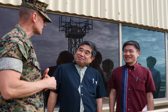 U.S. Marine Corps Col. Jeremy Beaven, left, commanding officer, Marine Corps Base Hawaii, gives a tour of the installation to Takekuni Ikeda, center, vice governor, Okinawa Prefectural  Government, on Kansas Tower at MCBH, Jan. 31, 2024. The visit highlighted the friendship between Okinawa and Hawaii as well as the shared challenges faced by both locales. (U.S. Marine Corps photo by Lance Cpl. Marcos AlbertoRocha)