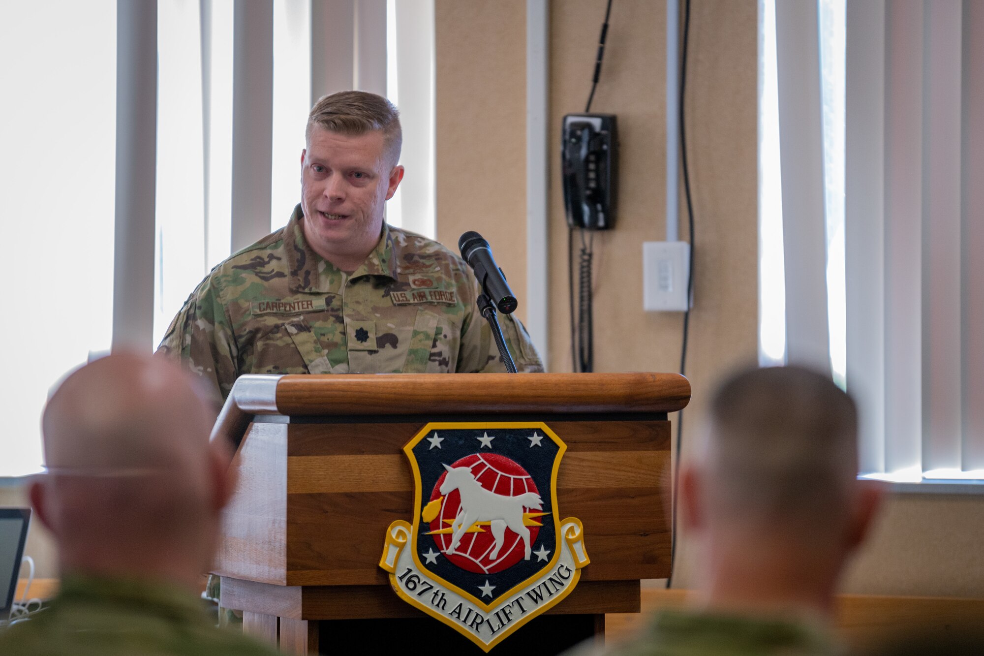 a man stands at a podium