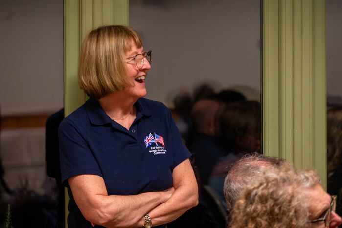 A member of the British-American Committee smiles.