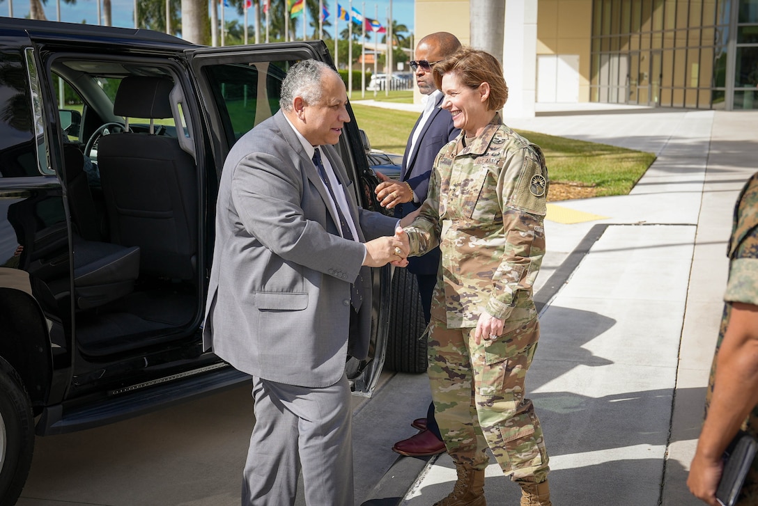 Secretary of the Navy Carlos Del Toro is greeted by the commander of U.S. Southern Command (SOUTHCOM), Army Gen. Laura Richardson, upon arrival to SOUTHCOM headquarters