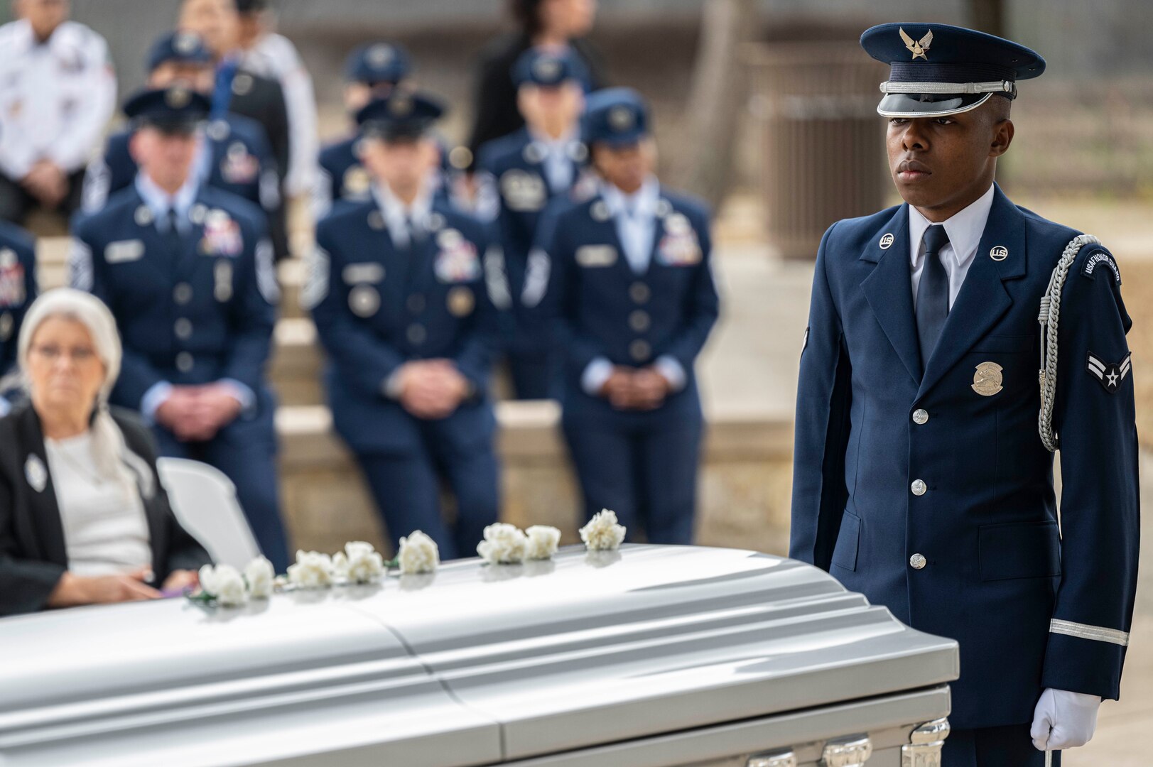 A U.S. Air Force Honor Guard member watches over the casket during the interment with full military honors of the fifth Chief Master Sgt. of the Air Force Robert D. Gaylor, Feb. 10, 2024 at Fort Sam Houston National Cemetery, Texas. Gaylor championed Air Force professional military education in the late '60s and '70s before he was promoted to Chief Master Sgt. of the Air Force in 1977. He continued to educate and inspire service members for more than 40 years after his retirement from military service. (U.S. Air Force photo by Tristin English).