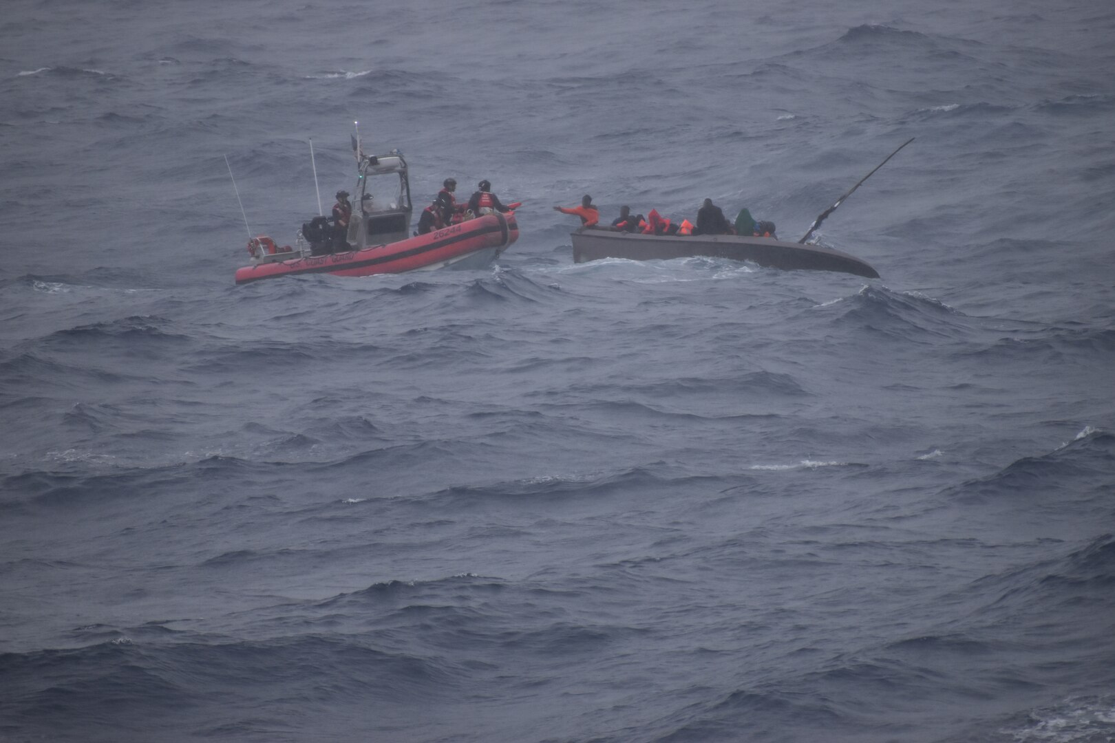 A Coast Guard Cutter Dependable (WMEC 626) small boat crew operates in 8-to-12-foot seas with winds gusting up to 46 mph while rescuing 33 Haitians from a sinking boat, Jan. 22, 2024, 6 miles off the coast of Haiti. Dependable’s crew patrolled the Coast Guard Seventh District’s area of operations during a two-month deployment to conduct maritime law enforcement missions. (U.S. Coast Guard photo)