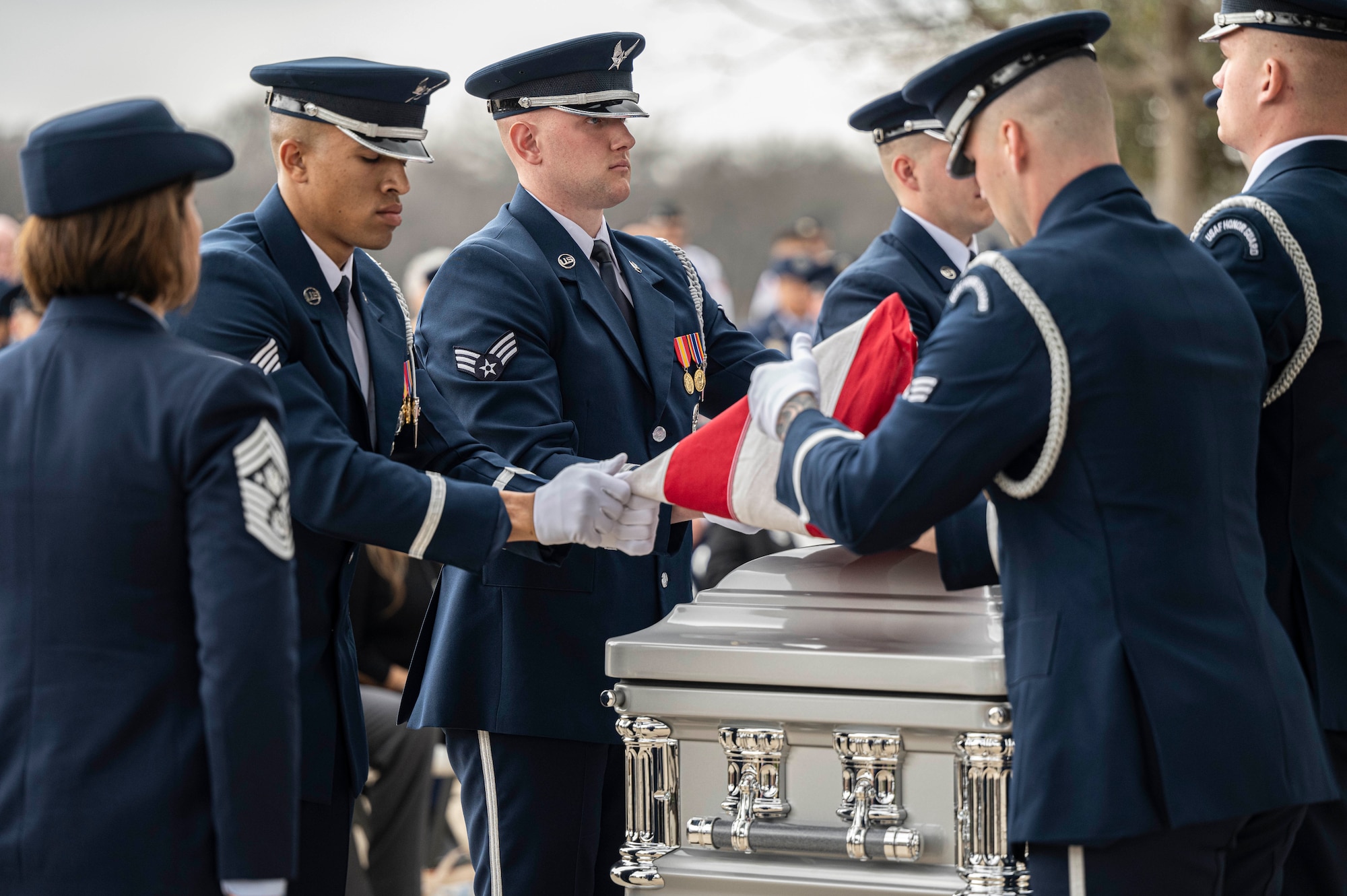 Members of the U.S. Air Force Honor Guard fold the U.S. flag during the interment with full military honors of the fifth Chief Master Sgt. of the Air Force Robert D. Gaylor, Feb. 10, 2024 at Fort Sam Houston National Cemetery, Texas. Gaylor championed Air Force professional military education in the late 1960s and 1970s before he was promoted to Chief Master Sgt. of the Air Force in 1977. He continued to educate and inspire service members for more than 40 years after his retirement from military service. (U.S. Air Force photo by Tristin English).