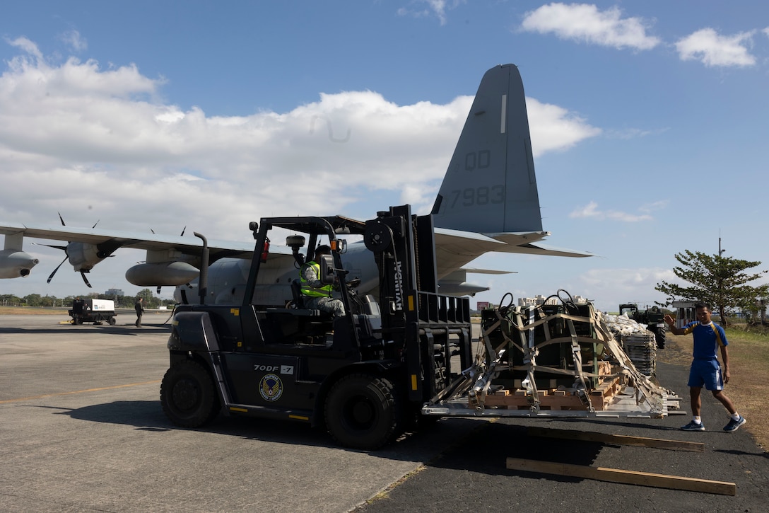 Philippine Air Force service members unload equipment off a KC-130J Super Hercules aircraft with Marine Aerial Refueler Transport Squadron 152 in preparation to transport Department of Social Welfare and Development family food packs at Villamor Airbase, Pasay City, Philippines, Feb. 11, 2024. At the request of the Government of the Philippines, the U.S. Marines of III Marine Expeditionary Force are supporting the U.S. Agency for International Development in providing foreign humanitarian assistance to the ongoing disaster relief mission in Mindanao. The forward presence and ready posture of III MEF assets in the region facilitated rapid and effective response to crisis, demonstrating the U.S.’s commitment to Allies and partners during times of need. (U.S. Marine Corps photo by Sgt. Savannah Mesimer)