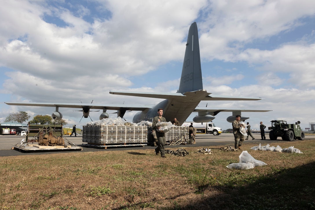 U.S. Marines with Marine Aerial Refueler Transport Squadron 152, 1st Marine Aircraft Wing, unload equipment from a KC-130J Super Hercules aircraft in preparation to transport Department of Social Welfare and Development family food packs at Villamor Airbase, Philippines, Feb. 11, 2024. At the request of the Government of the Philippines, the U.S. Marines of III Marine Expeditionary Force are supporting the U.S. Agency for International Development in providing foreign humanitarian assistance to the ongoing disaster relief mission in Mindanao. The forward presence and ready posture of III MEF assets in the region facilitated rapid and effective response to crisis, demonstrating the U.S.’s commitment to Allies and partners during times of need. (U.S. Marine Corps photo by Sgt. Savannah Mesimer)