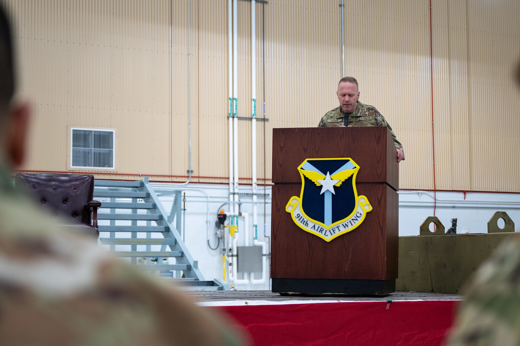 Maj. Jeremy Caskey, a 911th Airlift Wing chaplain, conducts an invocation during an assumption of command ceremony at the Pittsburgh International Airport Air Reserve Station, Pennsylvania, Feb. 3, 2024. U.S. Air Force Chaplains and the Chaplain Corps act and provide services such as invocations and benedictions. (U.S. Air Force photo by Staff Sgt. Timothy Leddick)