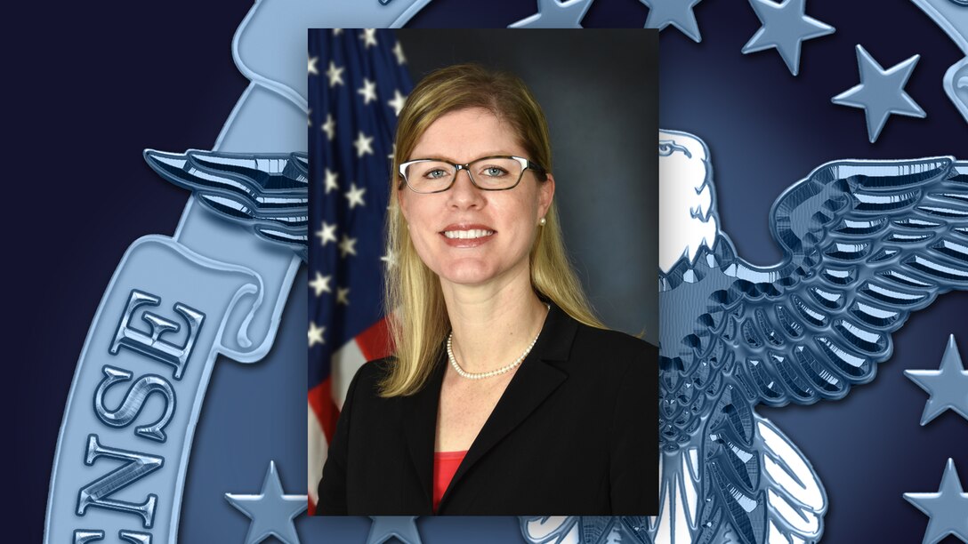 Head and shoulders picture of white woman with glasses in front of the DLA logo