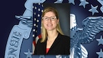 Head and shoulders picture of white woman with glasses in front of the DLA logo