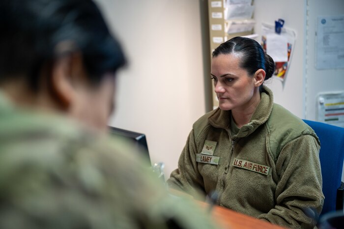 Senior Airman Athena Lamey, a 911th Aeromedical Staging Squadron dental assistant, checks a patient in at the Pittsburgh International Airport Air Reserve Station dental clinic, Pennsylvania, Feb. 3, 2024. Dental assistants act as the patient's advocate, display exceptional interpersonal customer service and manage patient records. (U.S. Air Force photo by Staff Sgt. Timothy Leddick)
