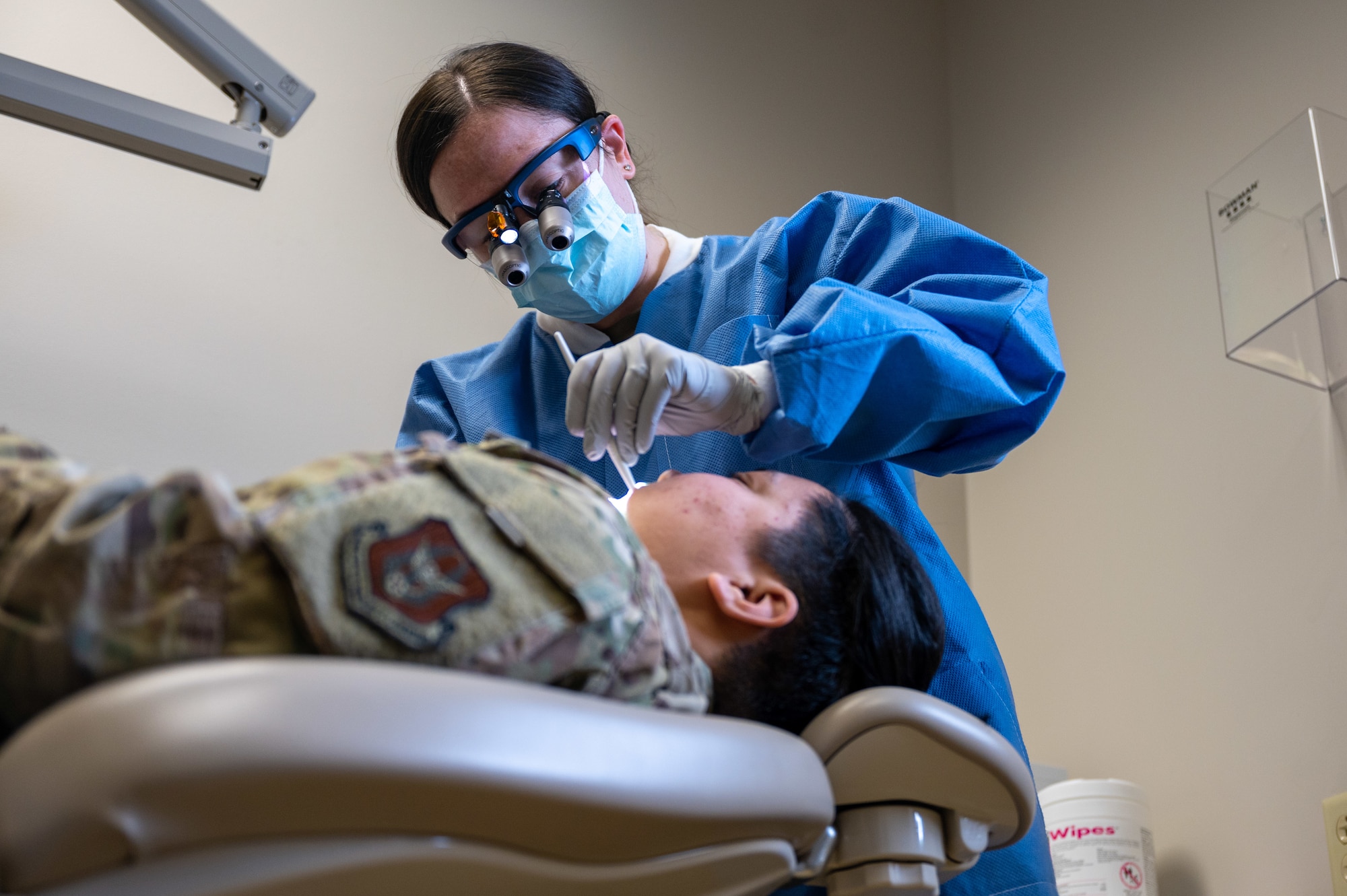 Maj. Emily Steiner, a 911th Aeromedical Staging Squadron general dentist, performs an oral examination at the Pittsburgh International Airport Air Reserve Station dental clinic, Pennsylvania, Feb. 3, 2024. Air Force dentists diagnose and treat oral diseases and abnormalities, review results and treatment plans and perform routine preventative exams. (U.S. Air Force photo by Staff Sgt. Timothy Leddick)
