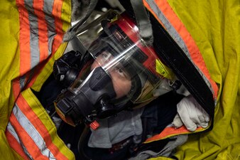 GM2 Gage Duncan communicates through a smoke blanket during a damage control drill aboard USS Sterett (DDG 104).