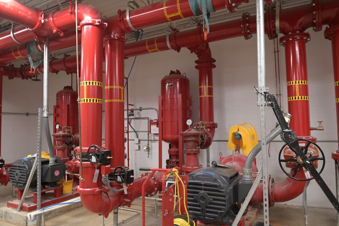 The water deluge fire protection system installed in an aircraft hangar of the Wisconsin Air National Guard's 115th Fighter Wing as seen on Apr. 13, 2023 at Truax Field in Madison, Wisconsin. In March 2023, the 115th Fighter Wing became the first U.S. Air Force base worldwide to terminate all use of foam-based fire suppression systems in its facilities. (U.S. Air National Guard photo by Isabella Jansen)