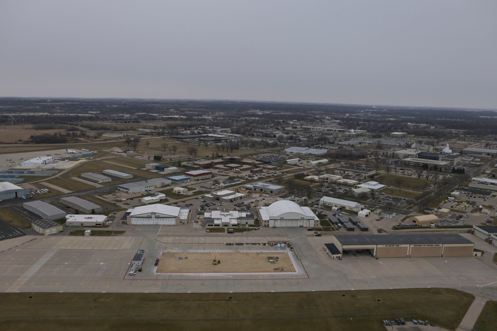 An aerial photograph of Truax Field’s facilities on Dec. 7, 2021.   In March 2023, the 115th Fighter Wing became the first U.S. Air Force base worldwide to terminate all use of foam-based fire suppression systems in its facilities. (U.S. Air National Guard photo by Capt. Leslie Westmont)