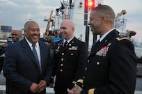 Maj. Jason Hanslovan, bilateral affairs officer, District of Columbia National Guard, shares a laugh with key D.C. Guard and Jamaica Defence Force state partnership program key leaders, on March 19, 2018, aboard the U.S. Coast Guard Cutter Resolute in Kingston, Jamaica. The reception aboard Resolute was held to celebrate an interagency agreement to combat transnational crime in Jamaica’s seas.