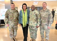 Maj. Gen. John C. Andonie, Commanding General (interim), District of Columbia National Guard; Brig. Gen. Aaron R. Dean II, The Adjutant General, and Command Sgt. Maj. Ronald L. Smith, Jr., Command Senior Enlisted Leader, greet Mayor Muriel Bowser during her arrival to the 25th Annual Senior Holiday Celebration at the D.C. Armory, Dec. 13, 2023. The event coincided with a D.C. National Guard Family Programs holiday lunch and learn.