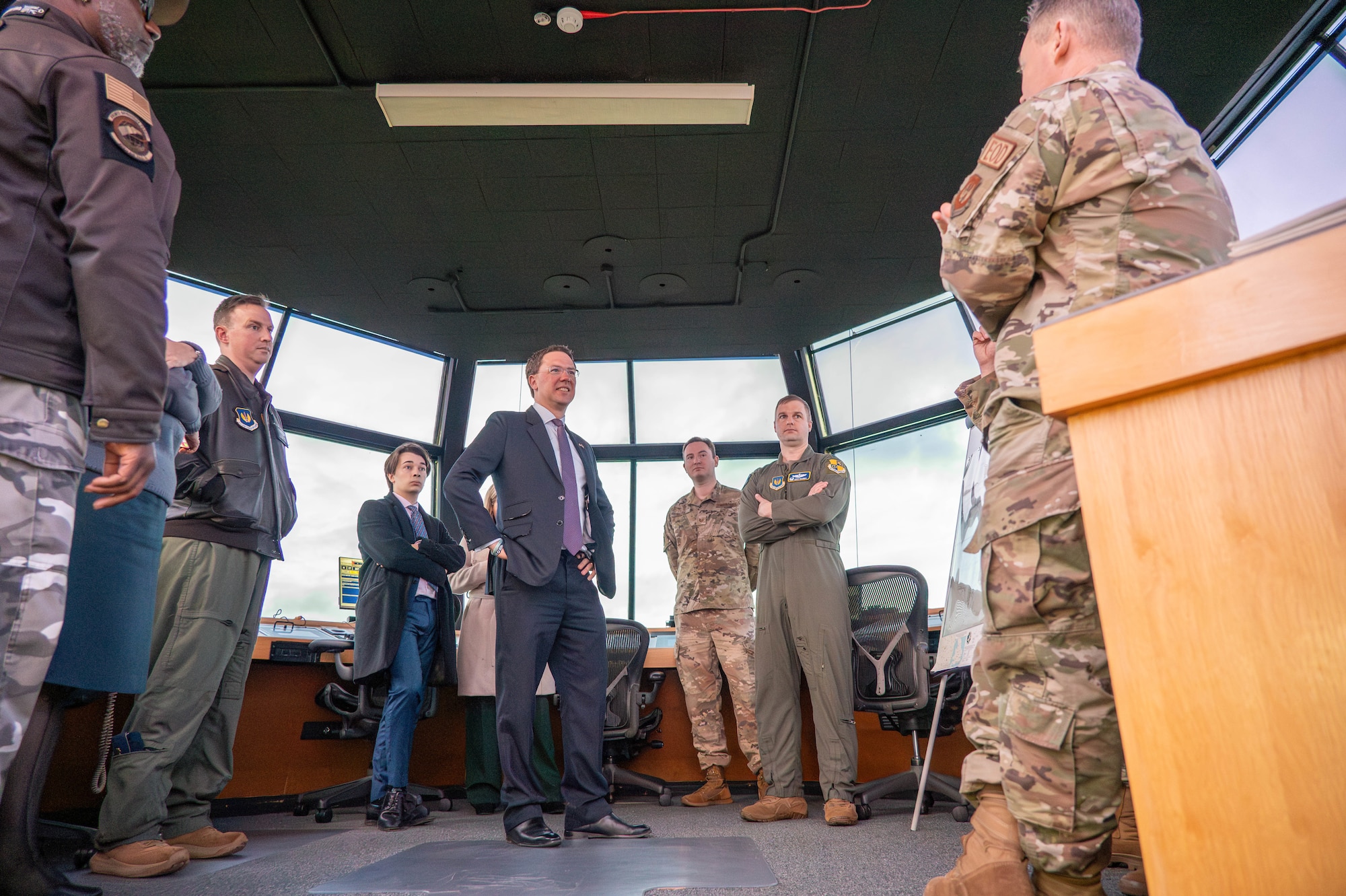 Robert Courts speaks with personnel in an air traffic control tower