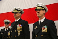 240202-N-IJ992-1439 OAK HARBOR, Wash. (Feb. 02, 2024) Rear Adm. Doug Verissimo, Commander Naval Air Forces, left, stands at attention with Capt. David Harris during the change of command ceremony of Electronic Attack Wing, U.S. Pacific Fleet, aboard Naval Air Station Whidbey Island (NASWI). Capt. David A. Ganci relieved Capt. David F. Harris as the commanding officer. (U.S. Navy photo by Mass Communication Specialist 2nd Class Andy Anderson)