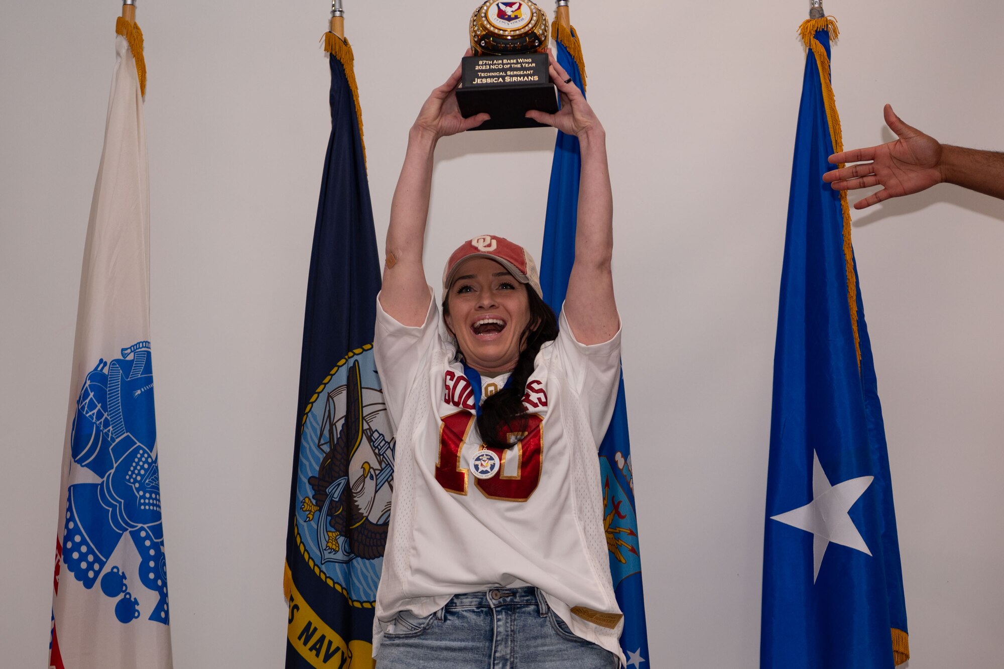 U.S. Air Force TSgt. Jessica Sirmans hold her award during the Annual Awards ceremony at JB MDL, Feb. 8, 2024. Members were recognized by JB MDL senior leaders for their exceptional performance throughout the year. (U.S. Air Force photo by Staff Sgt. Monica Roybal)