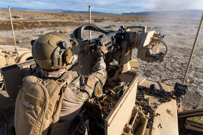 U.S. Air Force Senior Airman Collin Domingo, 9th Security Forces Squadron tactical response team member, Beale Air Force Base, California, fires a .50 caliber machine gun mounted on a Mine Resistant Ambush Protected All-Terrain Vehicle (M-ATV), at Fallon, Nevada, Jan. 30, 2024.