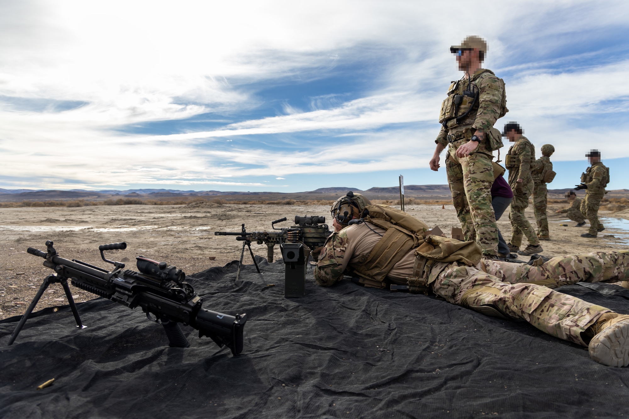 U.S. Air Force Senior Airman Collin Domingo, 9th Security Forces Squadron tactical response team member, Beale Air Force Base, California, fires a MK-48 machine gun during Exercise Dragon Trident 1 at Fallon, Nevada, Jan. 30, 2024.