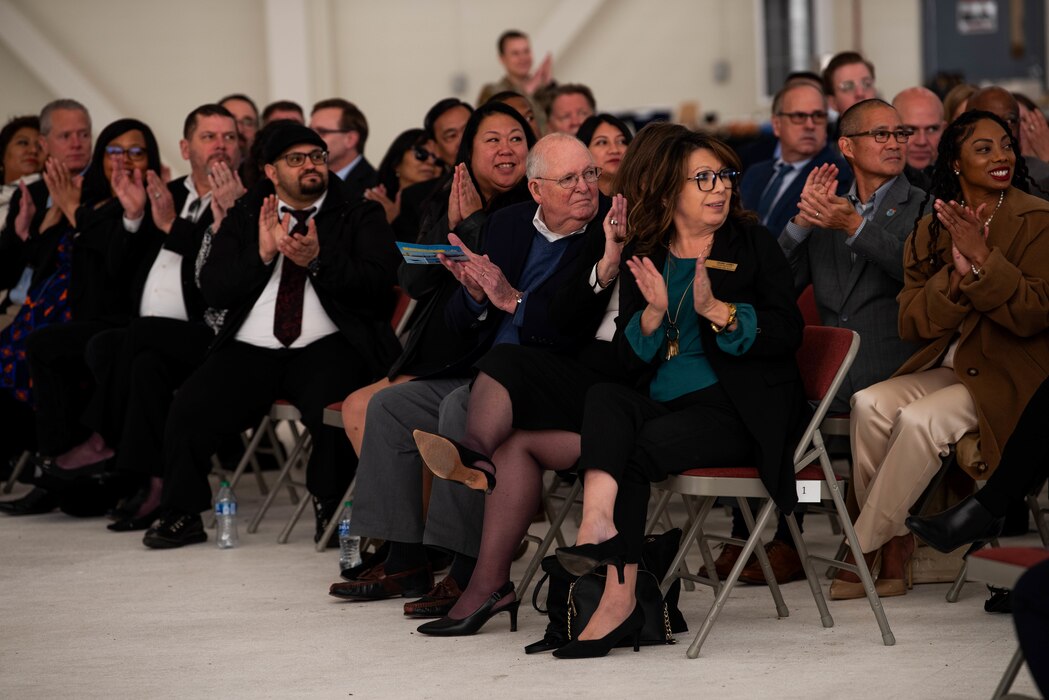 Guests in attendance applaud Airmen being recognized during the 2024 State of the Base ceremony