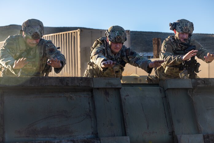 U.S. Air Force Airmen from the 9th Security Forces Squadron (SFS), Beale Air Force Base, California, roll a barricade during Exercise Dragon Trident at Fallon, Nevada, Jan. 29, 2024.