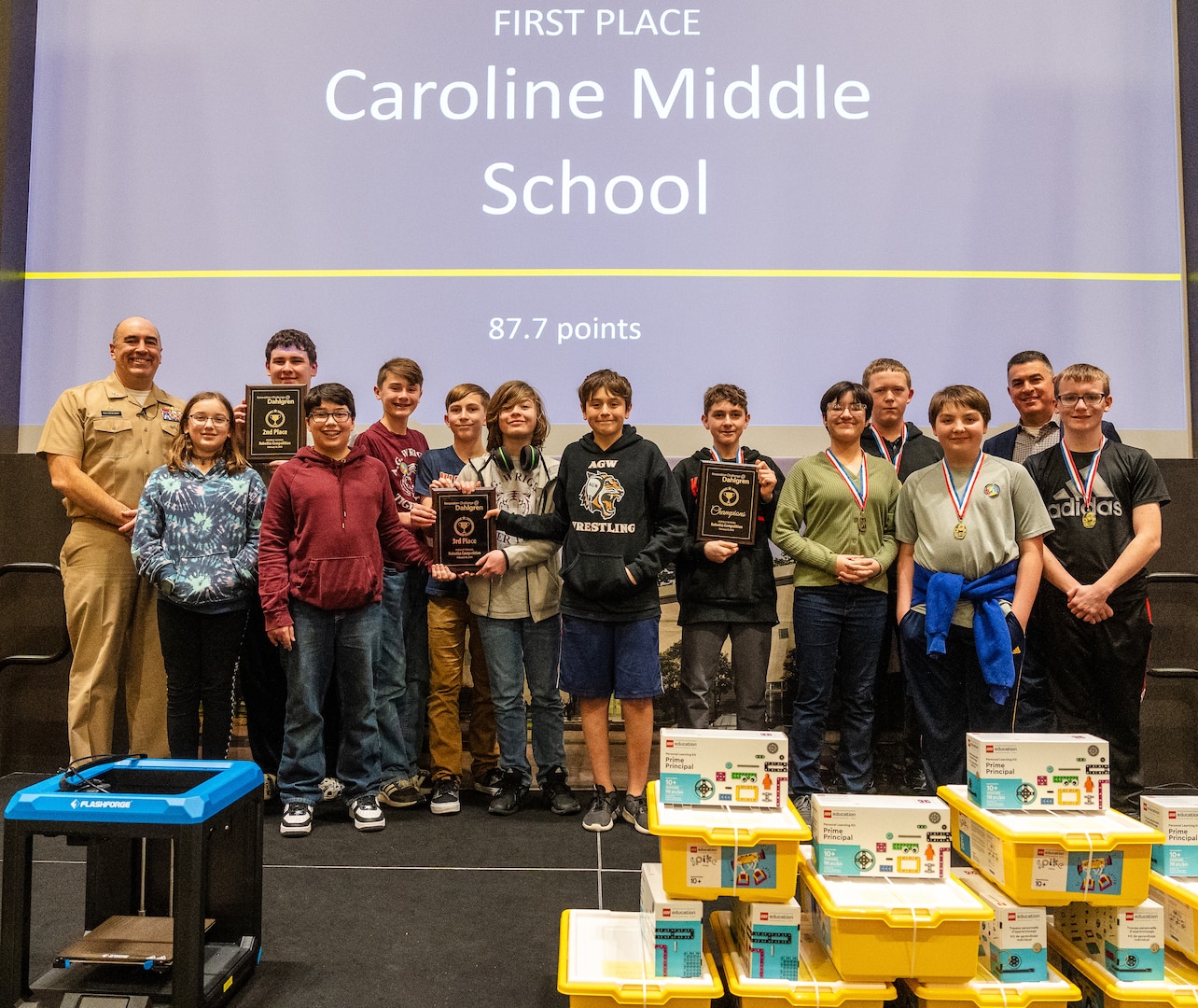 IMAGE: Caroline Middle School (right) earned first place, followed by James H. Carey Intermediate School (left) in second and A.G. Wright’s first team (center) won third in the inaugural Innovation Challenge @ Dahlgren: Middle School Robotics, Feb. 10.