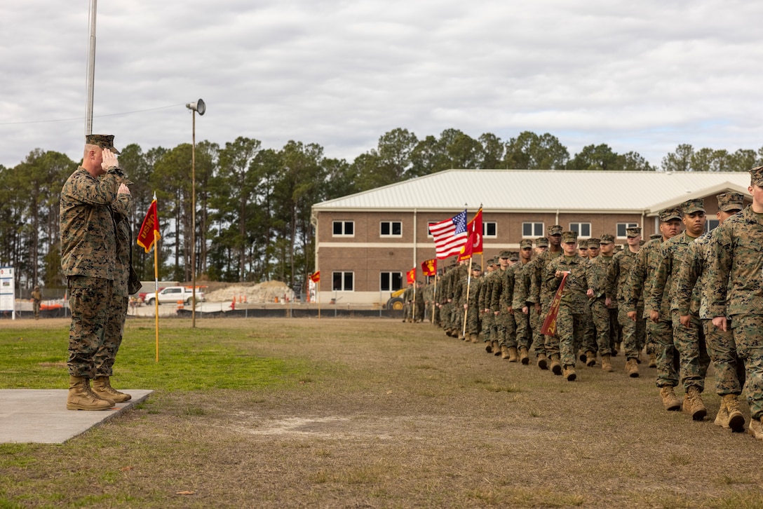 U.S. Marine Corps Brig. Gen. Michael E. McWilliams, left, commanding general, 2nd Marine Logistics Group, and Col. Karin Fitzgerald, commanding officer, 2nd Combat Readiness Regiment, 2nd MLG, salute during the pass and review at the 2nd CRR redesignation ceremony on Camp Lejeune, North Carolina, Feb. 5, 2024. During the ceremony, 2nd Supply Battalion was redesignated as 2nd Combat Readiness Regiment. (U.S. Marine Corps photo by Lance Cpl. Jessica J. Mazzamuto)