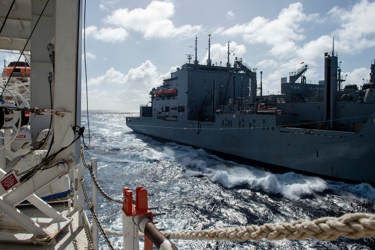 Ships sail side-by-side.