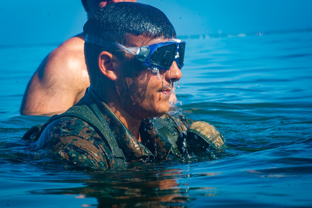 A group of Marines swims.