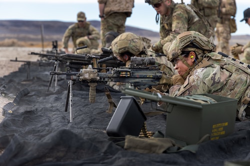 U.S. Air Force Senior Airman Gracia Bolainez, 9th Security Forces Squadron (SFS) military working dog handler from Beale Air Force Base, California, fires a MK-46 machine gun during Exercise Dragon Trident 1 at Fallon, Nevada, Jan. 30, 2024.