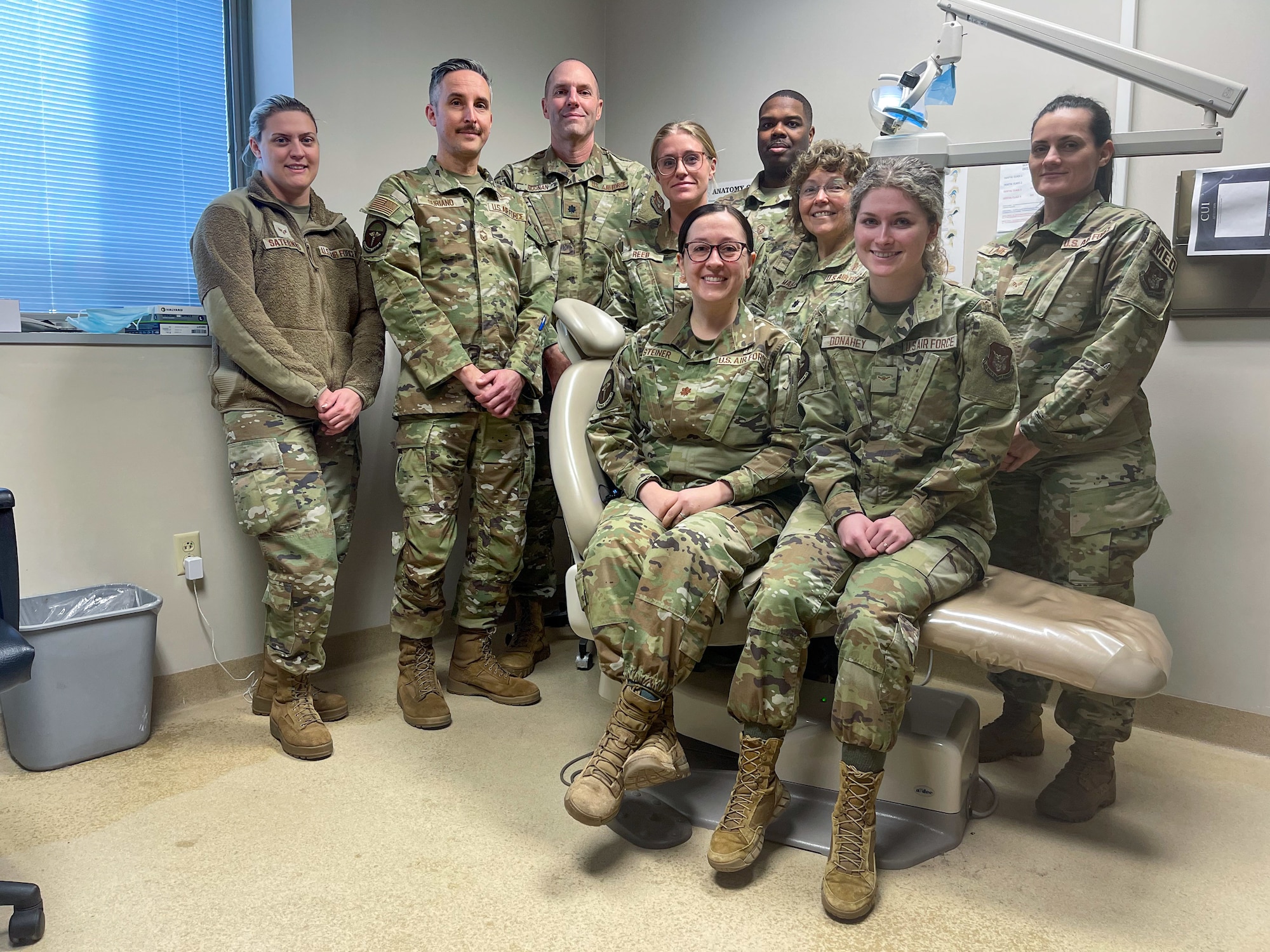 The 911th Aeromedical Staging Squadron dental team poses for a photo at the Pittsburgh International Airport Air Reserve Station dental clinic, Pennsylvania, Feb. 4, 2024. The Air Force dental component is composed of commissioned officer dentists and enlisted dental assistants. (U.S. Air Force photo by Staff Sgt. Timothy Leddick)