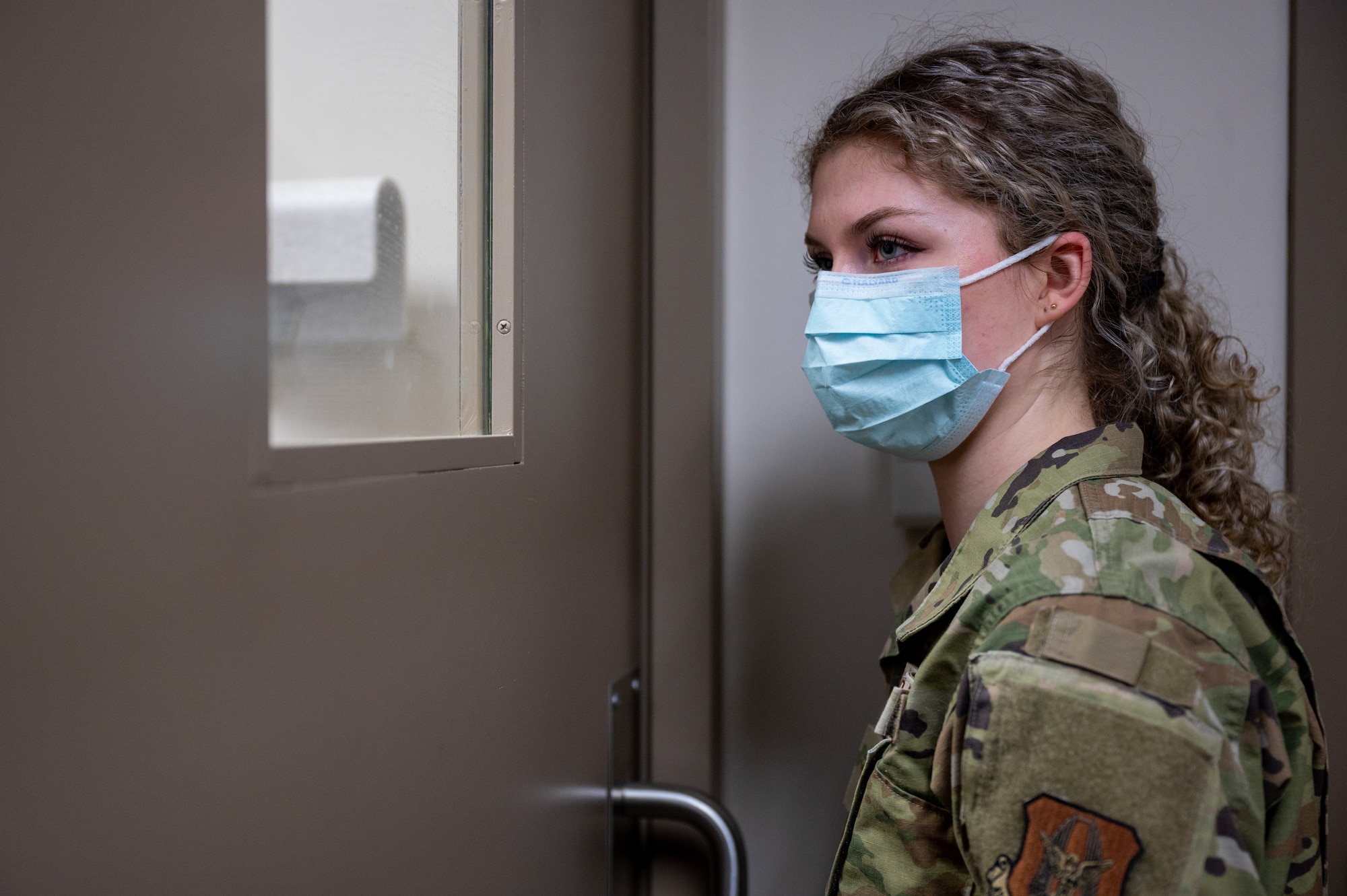 Airman Rilee Donahey, a 911th Aeromedical Staging Squadron dental assistant, captures a patient's x-ray from a safe distance at the Pittsburgh International Airport Air Reserve Station dental clinic, Pennsylvania, Feb. 3, 2024. A dental assistant's primary tasks include ensuring proper supplies are stocked, acquiring prescribed x-rays and set up and clean up of procedures.