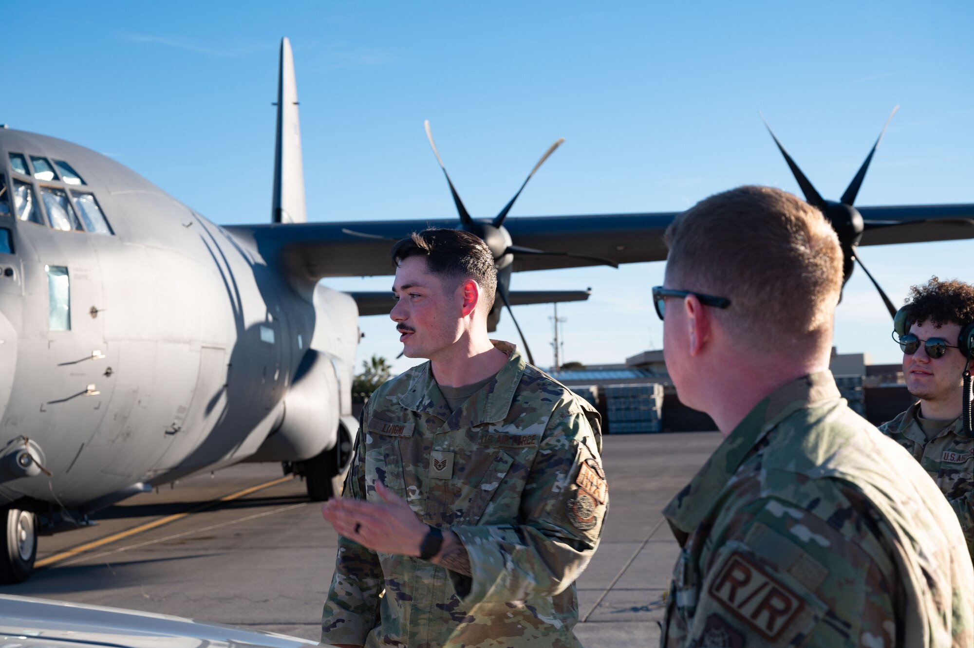 U.S. Air Force Staff Sgt. Blake Livigni, a 317th Aircraft Maintenance Squadron aircraft maintenance technician assigned to Dyess Air Force Base Texas, speaks with his team about maintenance procedures for the C-130J Super Hercules during Bamboo Eagle 24-1 at Nellis Air Force Base, Nevada, Jan. 29, 2024. Over 3,000 U.S. service members across four branches flew, maintained and supported more than 150 aircraft from over 20 units in multiple locations during Bamboo Eagle. (U.S. Air Force photo by Airman 1st Class Timothy Perish)
