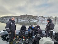 Sailors from Explosive Ordnance Disposal Mobile Unit (EODMU) Eight conduct mine counter measure diving operations with clearance divers from Norway and Denmark during exercise Arctic Specialist 24, Feb. 6, 2024. Exercise Arctic Specialist 2024 is an annual Norway-hosted multinational explosive ordnance disposal and mine countermeasures exercise focused on enhancing combined expeditionary command and control capabilities in the high-latitude and austere environments offered by Norway and its territorial waters. (U.S. Navy courtesy photo provided by Explosive Ordnance Disposal Mobile Unit Eight)