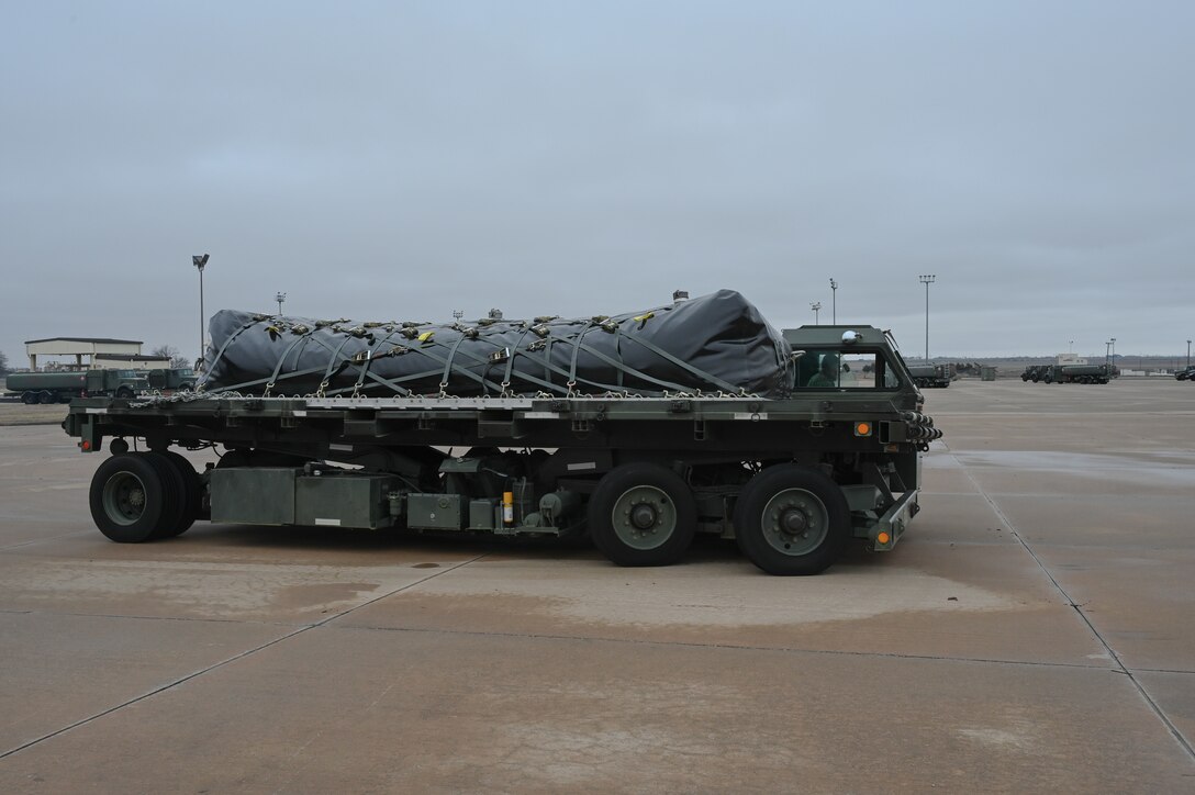 A fuel bladder is on  cargo loader