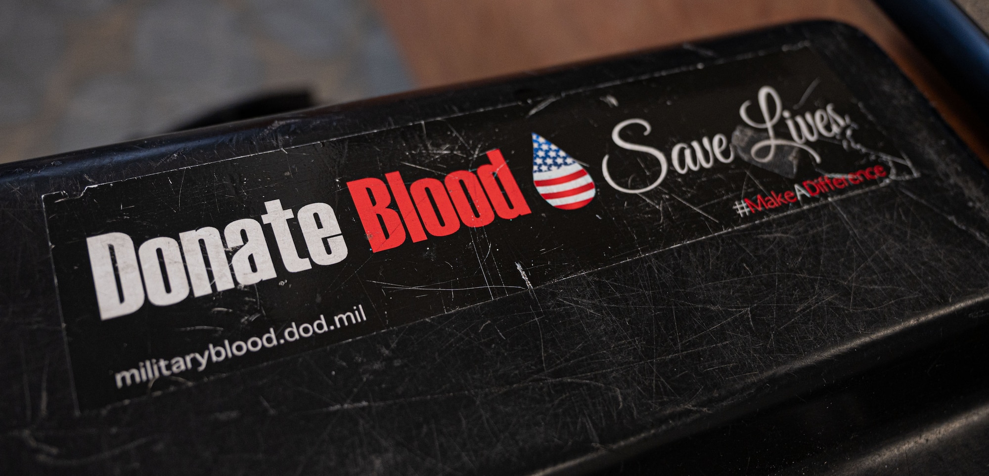 A donation sticker is placed on a medical supply container during a blood drive at Dover Air Force Base, Delaware, Feb. 12, 2024. The Armed Service Blood Program, also known as the Military Blood Program, is the official military provider of blood products to U.S. armed forces. (U.S. Air Force photo by Airman 1st Class Amanda Jett)