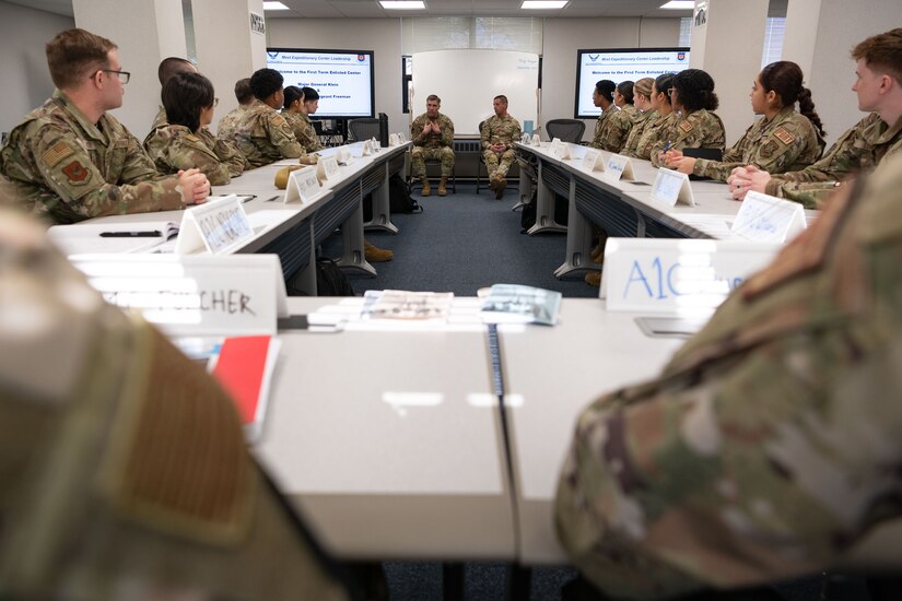 U.S. Air Force Maj. Gen. John Klein, U.S. Air Force Expeditionary Center commander, and Chief Master Sgt. Courtney Freeman, USAFEC command chief, speak with Airmen at the First Term Enlisted Center during a tour of Joint Base McGuire-Dix-Lakehurst, N.J., Feb. 8, 2024. The tour included stops at unaccompanied housing dorms, the Oasis Lounge and the Airman Leadership School. (U.S. Air Force photo by Staff Sgt. Monica Roybal)