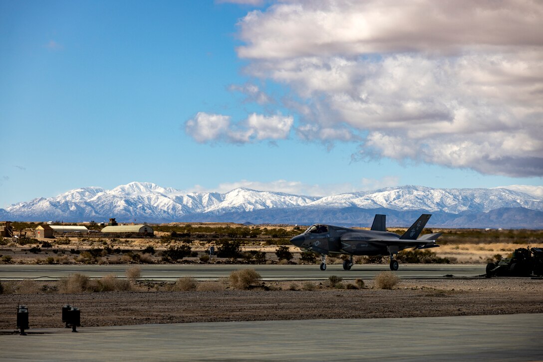 A U.S. Marine Corps F-35B Lightning II assigned to Marine Fighter Attack Squadron (VMFA) 211, Marine Aircraft Group 13, 3rd Marine Aircraft Wing, taxis toward a forward arming and refueling point (FARP) during Integrated Training Exercise 2-24 at Camp Wilson, Marine Corps Air Ground Combat Center Twentynine Palms, California, Feb. 7, 2024. A FARP extends the capabilities of rotary or fixed wing aircraft to allow rearming and refueling of the aircraft without having to return to a forward operating base. ITX is designed to provide large forces the opportunity to command and control their Marines through a live-fire program incorporating every element of the Marine Air-Ground Task Force. (U.S. Marine Corps photo by Lance Cpl. Jackson Rush)