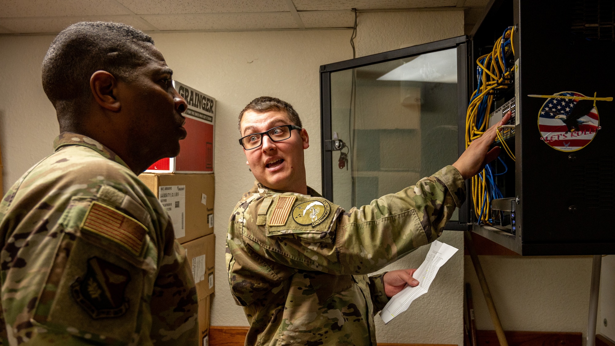U.S. Air Force Senior Airmen Jerremy Huck, 47th Communications Squadron (CS) technician, shows Col. Robert Moore, 47th Mission Support Group commander, the process of transferring data cords from the old switch to the new switch at Laughlin Air Force Base, Texas, Feb. 6, 2024. Leadership visits to individual squadrons, such as the 47th CS, allow for a better understanding of the behind-the-scenes mission that supports Laughlin’s mission. (U.S. Air Force photo by Staff Sgt. Nicholas Larsen)