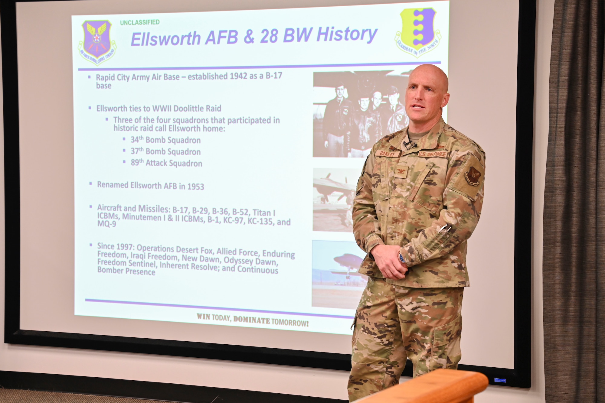 U.S. Air Force Col. Derek Oakley, 28th Bomb Wing commander, speaks during a “State of the Base” address at Ellsworth Air Force Base, South Dakota, Feb. 12, 2024. Oakley addressed recent events involving Ellsworth and its B-1B Lancers to local media outlets. (U.S. Air Force photo by Airman 1st Class Brittany Kenney)
