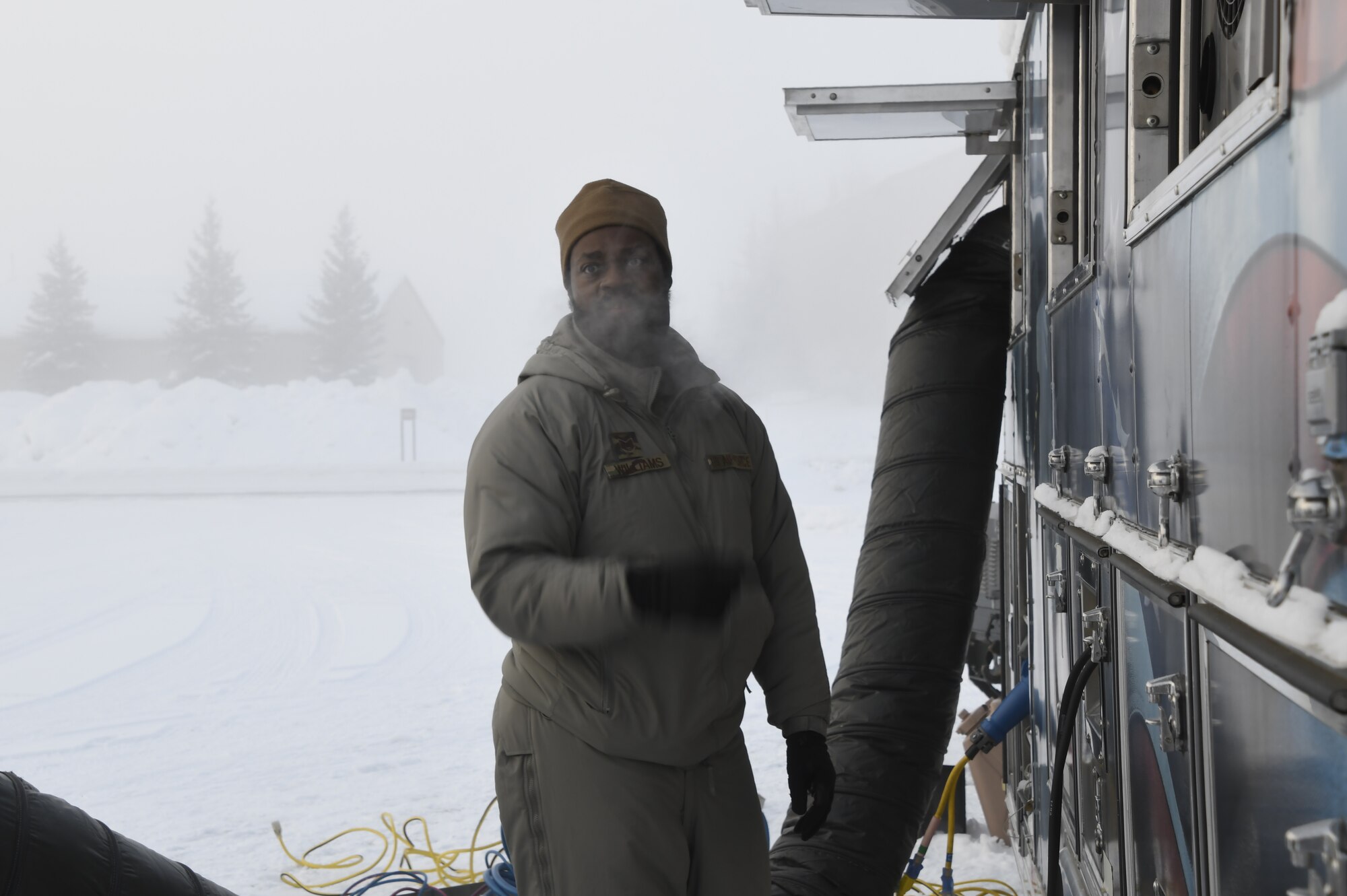 The 168th Services Airmen prepare and test the Disaster Relief Mobile Kitchen trailer in -40 degree temperatures.