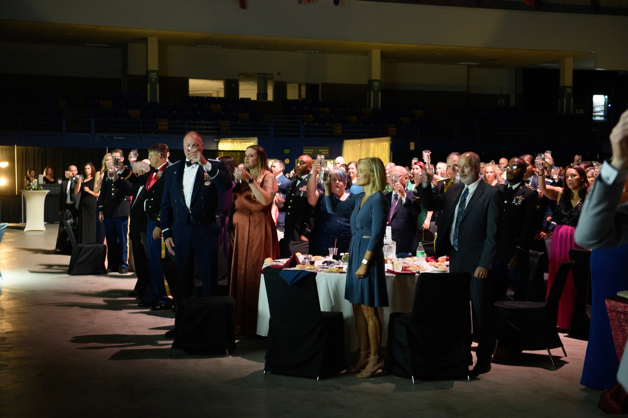 Fairbanks community and military members raise a glass in honor of military members missing in action as a part of the prisoners of war and MIA ceremony at the Fairbanks Chamber of Commerce Military Appreciation Banquet.