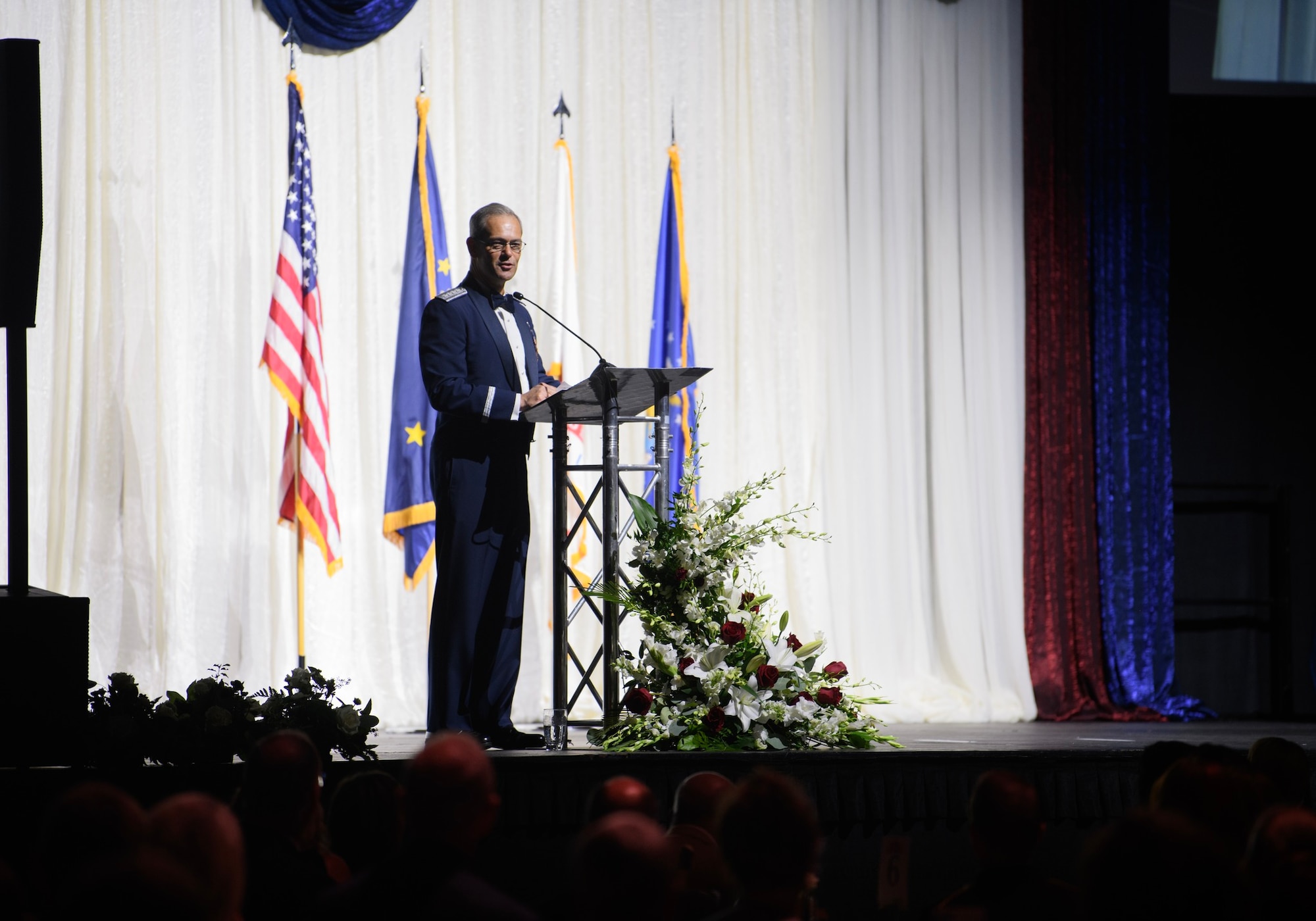 commander of Pacific Air Forces, The Air Component Commander of U.S. Indo-Pacific Command, and the executive director of Pacific Air Combat Operation, speaks as the distinguished guest speaker during the Fairbanks Chamber of Commerce Military Appreciation Banquet.