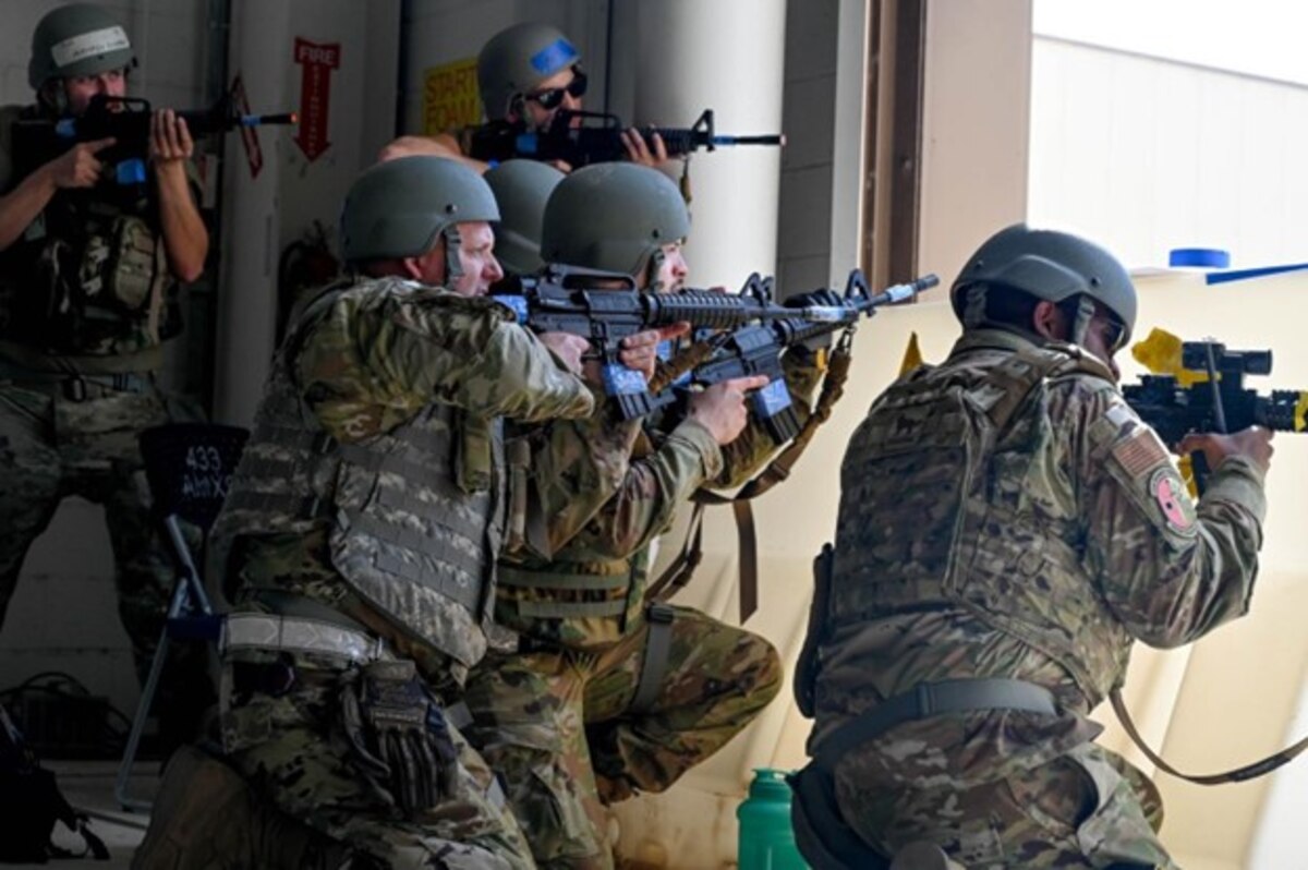 433rd Airlift Wing reservists respond to an armed attack on a deployed operational entry control point during Exercise Dragon’s Den at Joint Base San Antonio-Lackland, Texas on Feb. 6, 2024.