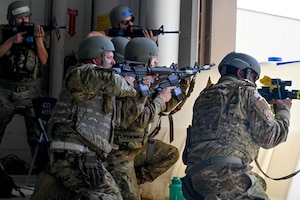 433rd Airlift Wing reservists respond to an armed attack on a deployed operational entry control point during Exercise Dragon’s Den at Joint Base San Antonio-Lackland, Texas on Feb. 6, 2024.