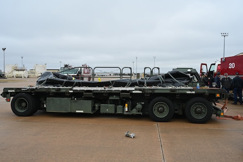 A fuel bladder prototype lays on a cargo loader