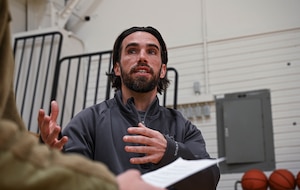 Luke Christy, Health and Fitness Program Manager assigned to the 910th Force Support Squadron, talks with a public affairs specialist concerning health and fitness of Airmen at the fitness center, Feb. 13, 2024, at Youngstown Air Reserve Station, Ohio.